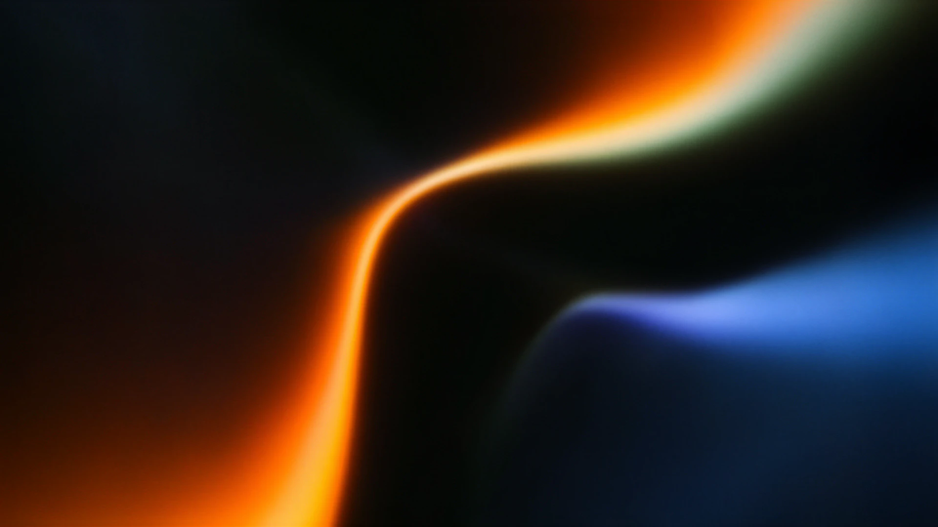 A dramatic abstract wallpaper where glowing orange and icy blue curves sweep through deep black space, creating a smooth, cinematic sense of motion.