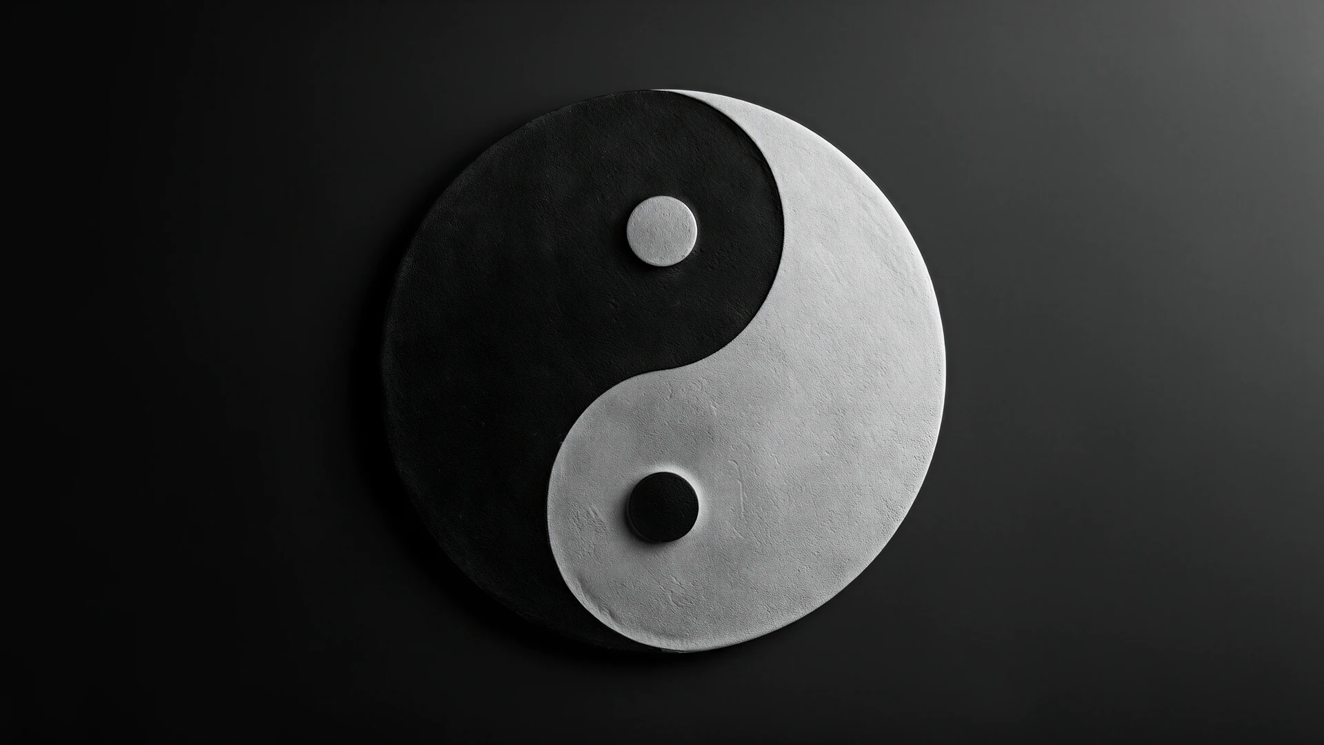 A striking yin-yang symbol emerges from the darkness, pairing textured black and silver curves in a timeless portrait of harmony and contrast.